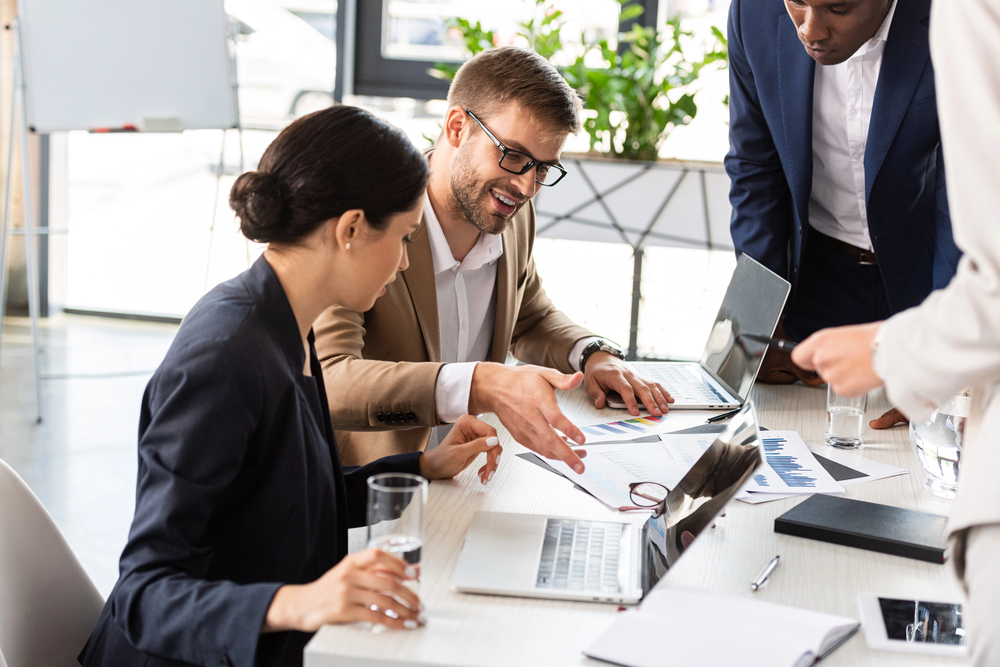 Business team reviewing reports together